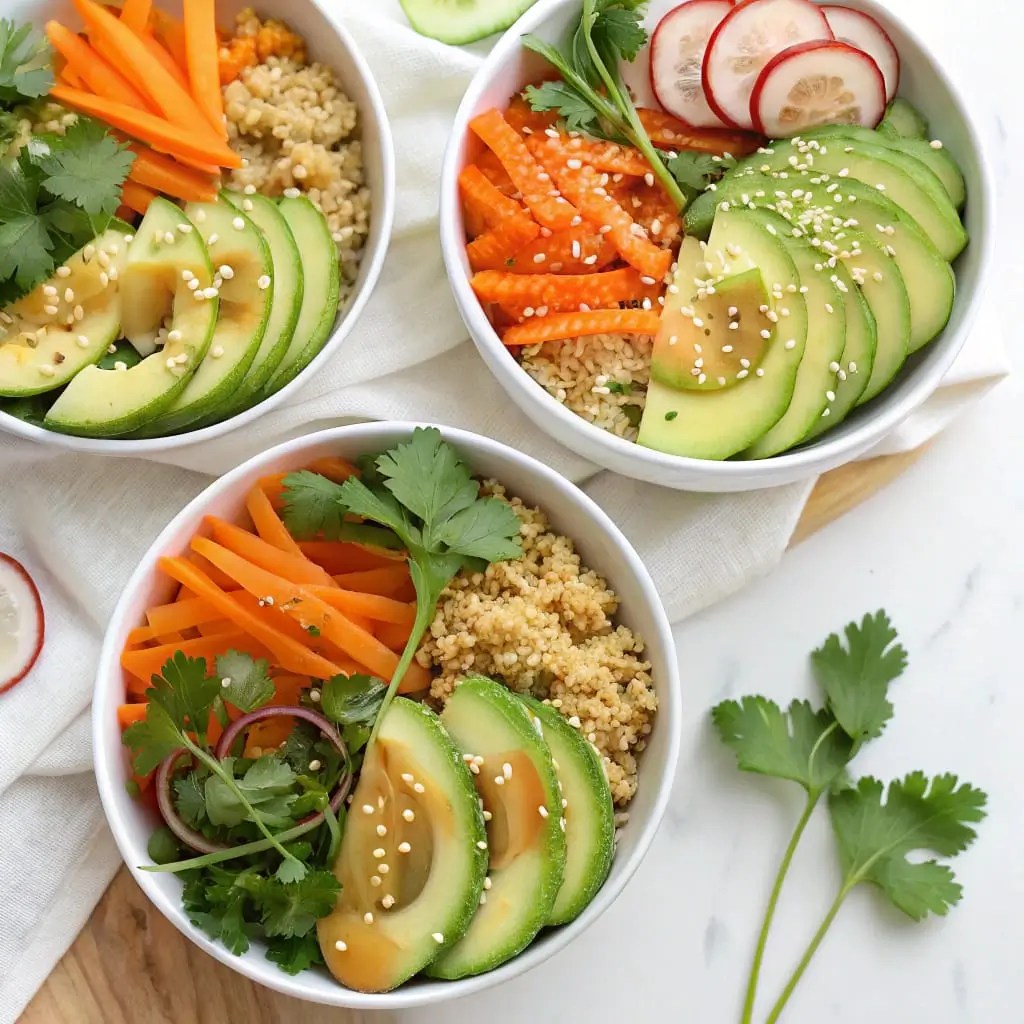 A vibrant Miso Ginger Quinoa Bowl with fresh veggies, avocado, and sesame seeds.